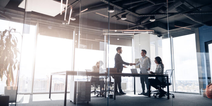 people-standing-near-table-team-young-businessmen-working-communicating-together-office