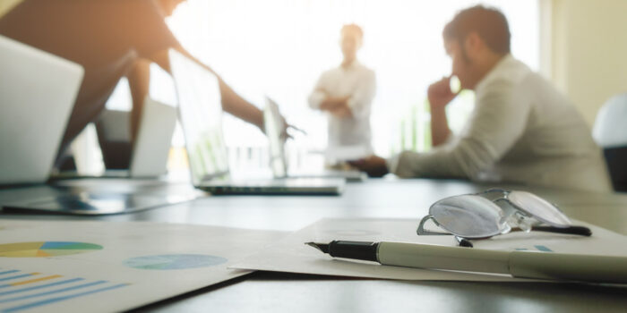 business-concept-with-copy-space-office-desk-table-with-pen-focus-analysis-chart-computer-notebook-cup-coffee-desk-vintage-tone-retro-filter-selective-focus